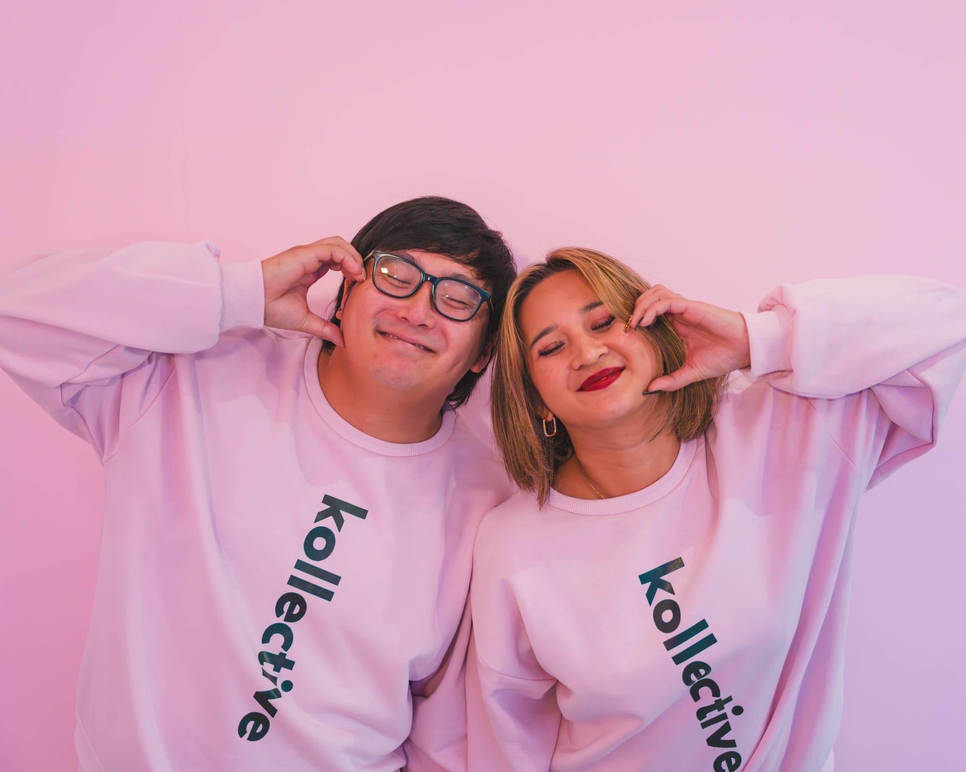 Kollective Studios team making heart hands